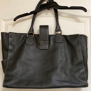 Black leather bag. Maroon cloth inside.